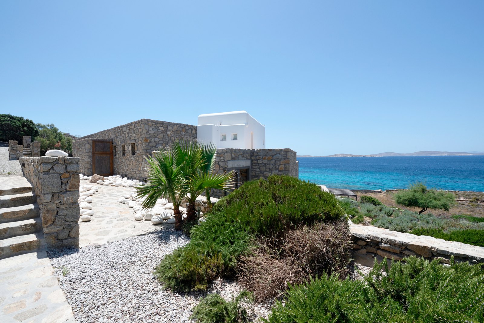 The stone houses of the estate above the sea